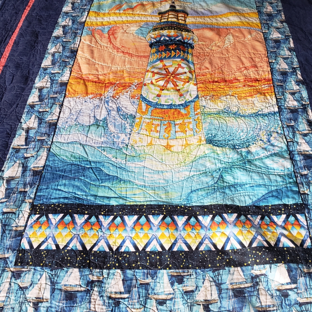 Coastal Lighthouse Quilt with Blue and Orange Accents